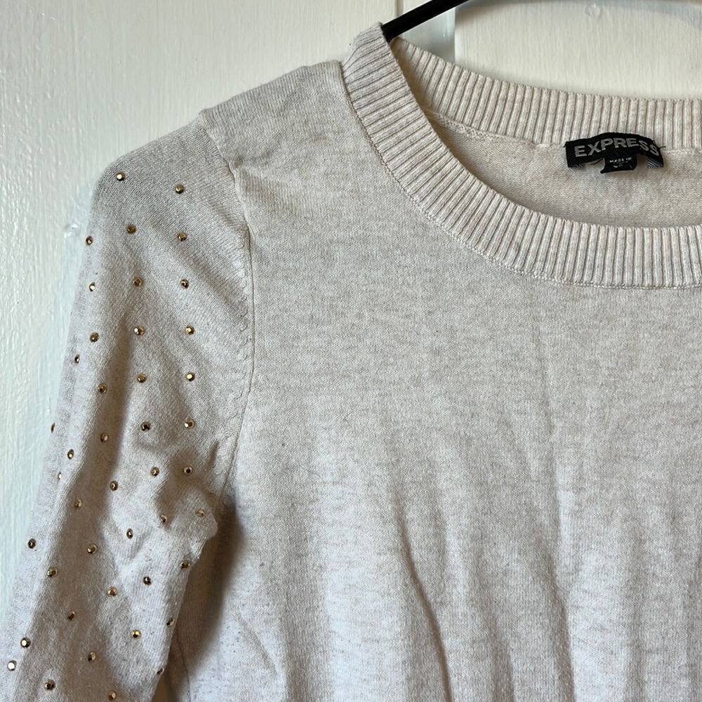 Express cream colored crew neck with gold embellishments. Size small